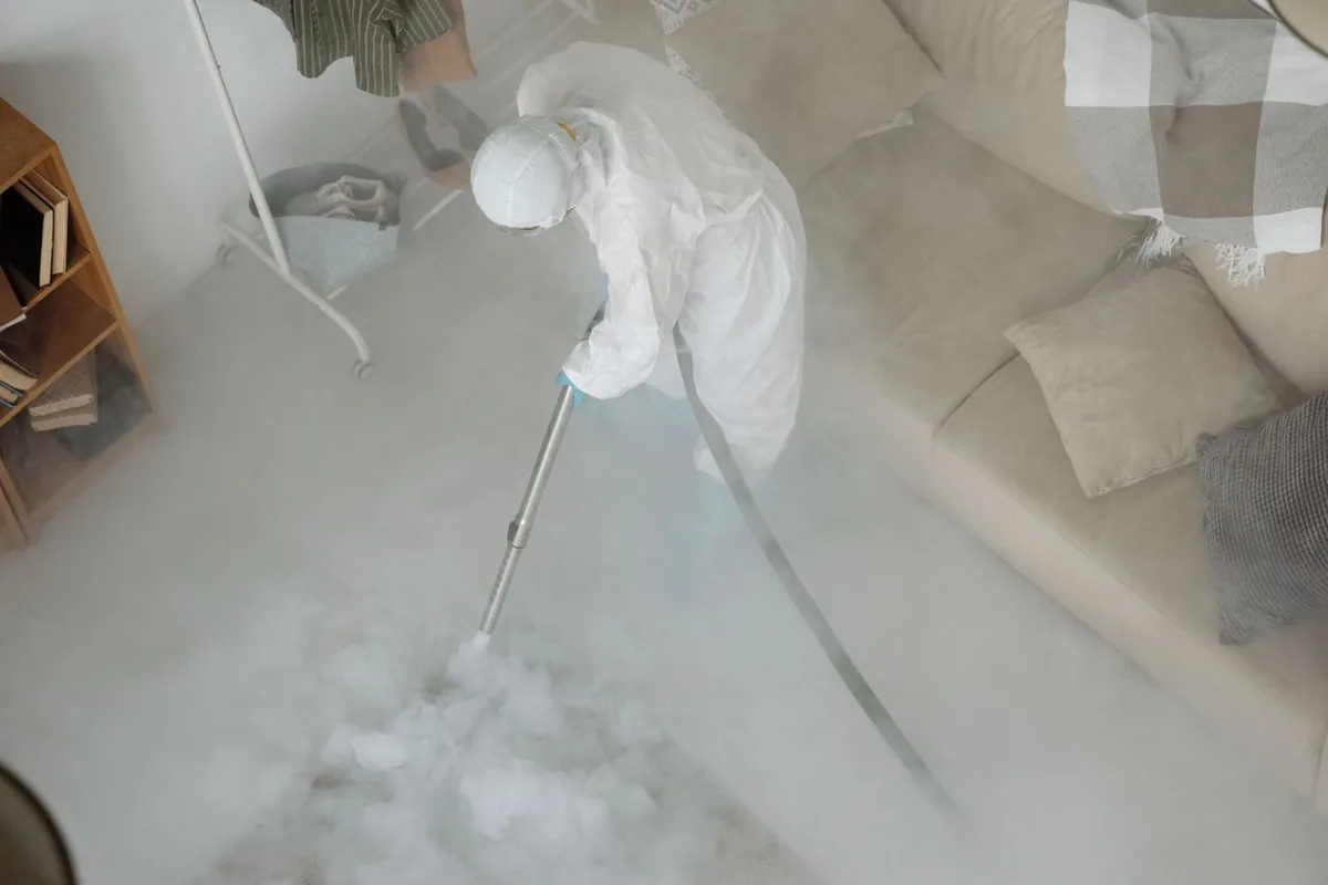 Biohazard cleanup technician in protective equipment, Sandusky, MI